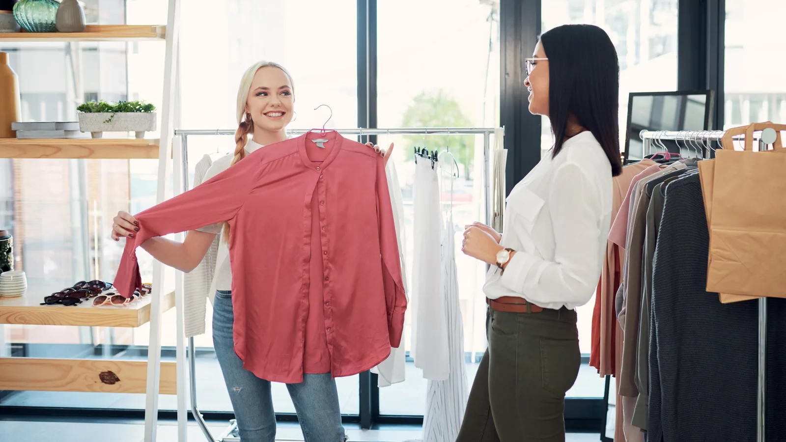 retail staff helping customers clothing store interior